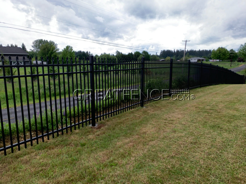 Black Aluminum Fence on rolling hill - Style 1 Classic Spear Top