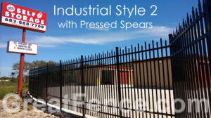 Industrial aluminum fence with pressed spears surrounding a self-storage facility