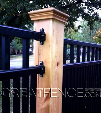 Aluminum Rail End mounts connecting aluminum fence panel to a wood post