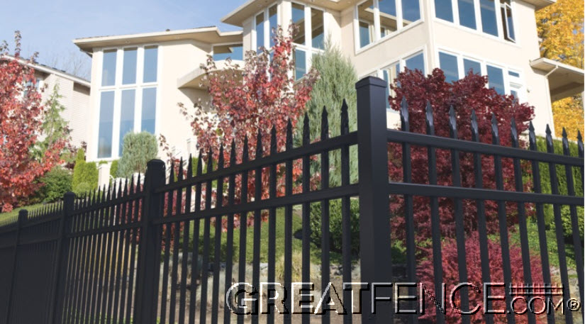 Residential black aluminum fence Style 1 with spear top design in front of modern home and fall landscaping