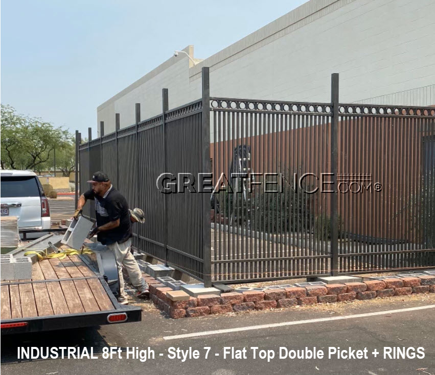 Industrial 8ft aluminum fencing Style 7 flat top double picket with decorative rings installed outside commercial building – GreatFence.com