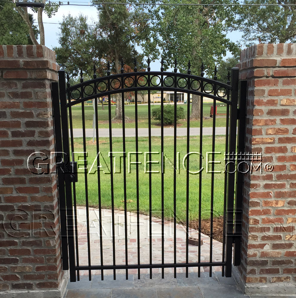 arched commercial aluminum walk gate with sunburst arch, rings and finials.