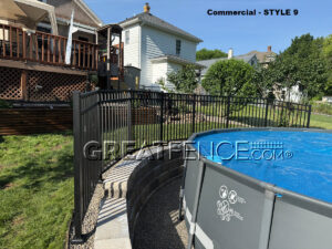 Black aluminum pool fence with angles and aluminum post welded plate, plate covers