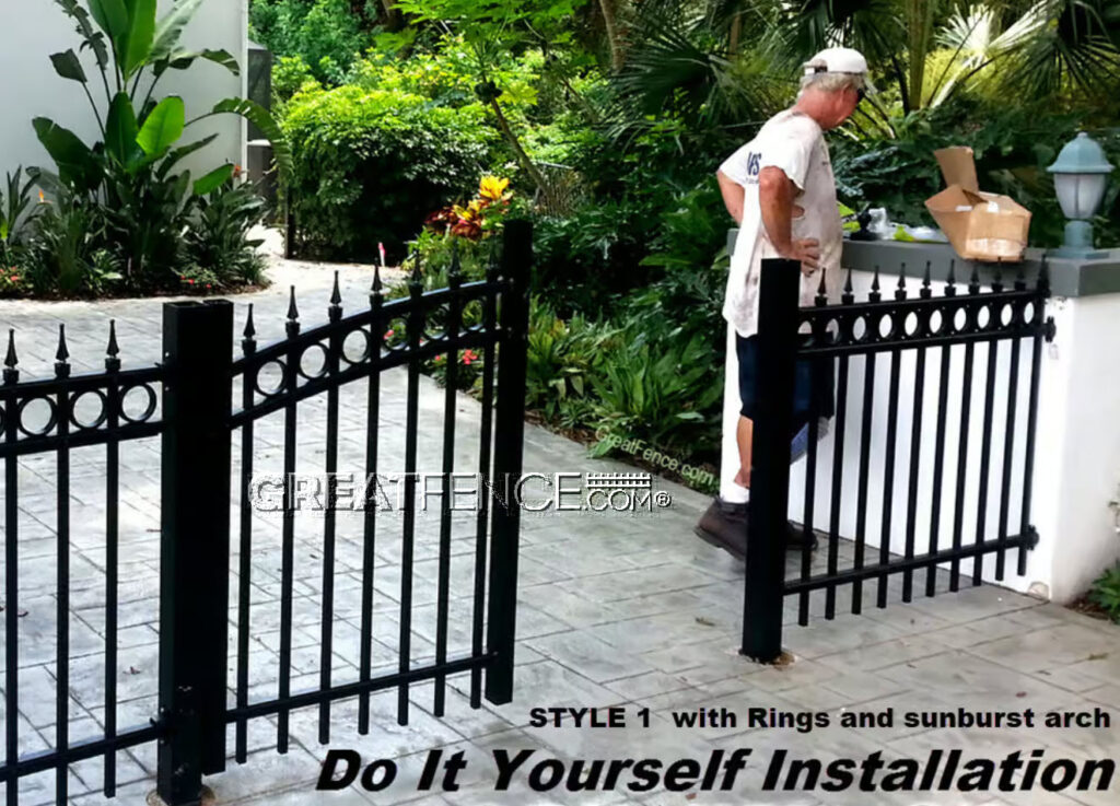 A man installing a black aluminum gate