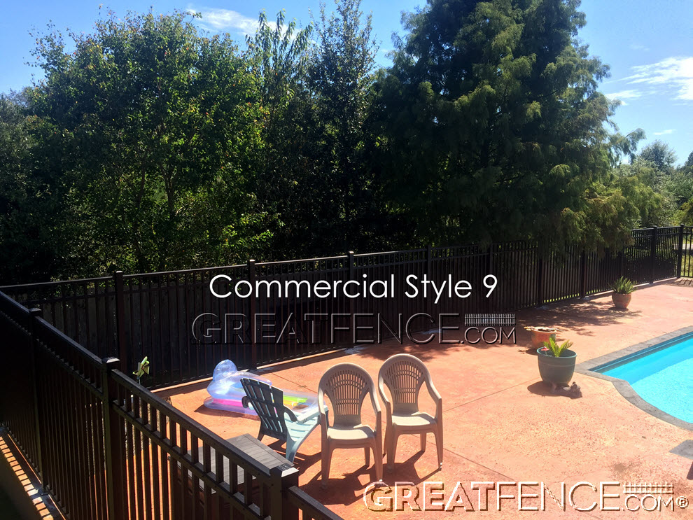 Black commercial aluminum pool fence installed around a residential swimming pool – Style 9 by GreatFence