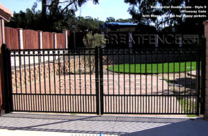 residential aluminum driveway gate with puppy pickets