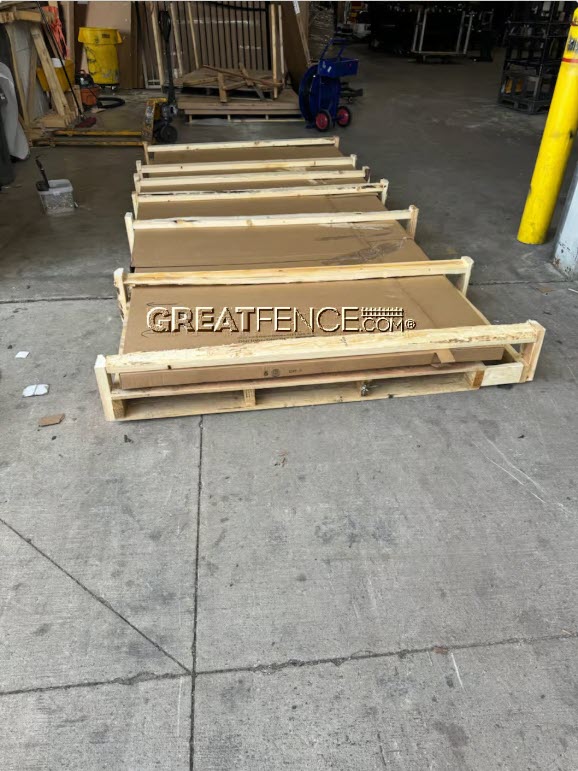 Forklift-ready heavy-duty wood crate protecting a 30 foot aluminum driveway gate during flat-bed shipping from GreatFence.com